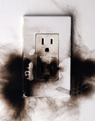 Burnt 3-prong electrical outlet