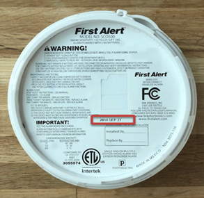 The back of a First Alert CO detector showing the expiration date.