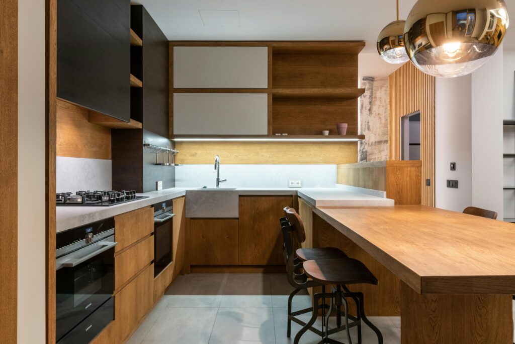 A kitchen with a countertop and stools